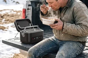 An owner eating out of the tray on a tailgate